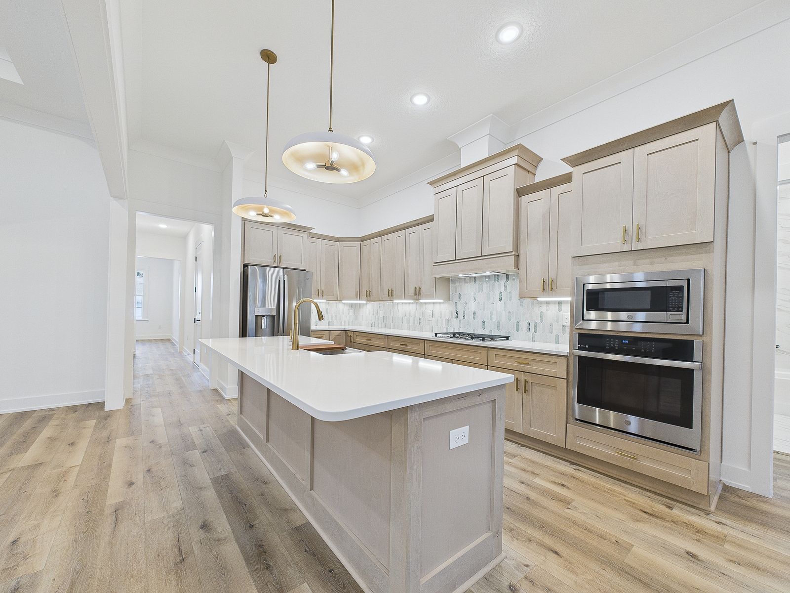 Kitchen with a long island and double wall ovens